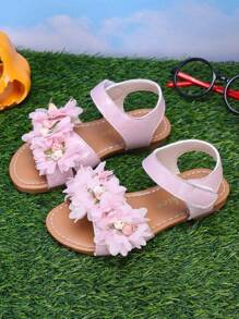 Sandalias de flores de verano 2025, sandalias de playa con suela suave, estilo princesa de dedo abierto, diseño lindo y de moda para niñas