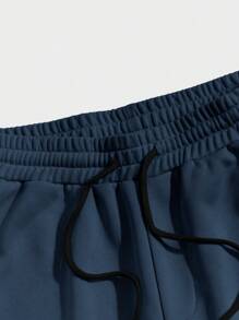 Pantalones cortos deportivos casuales de verano para hombres con corte holgado y estampado gráfico de letra de baloncesto