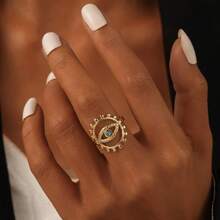 Edelstahl Ring mit goldtonem offenem Ausschnitt und blauem Auge