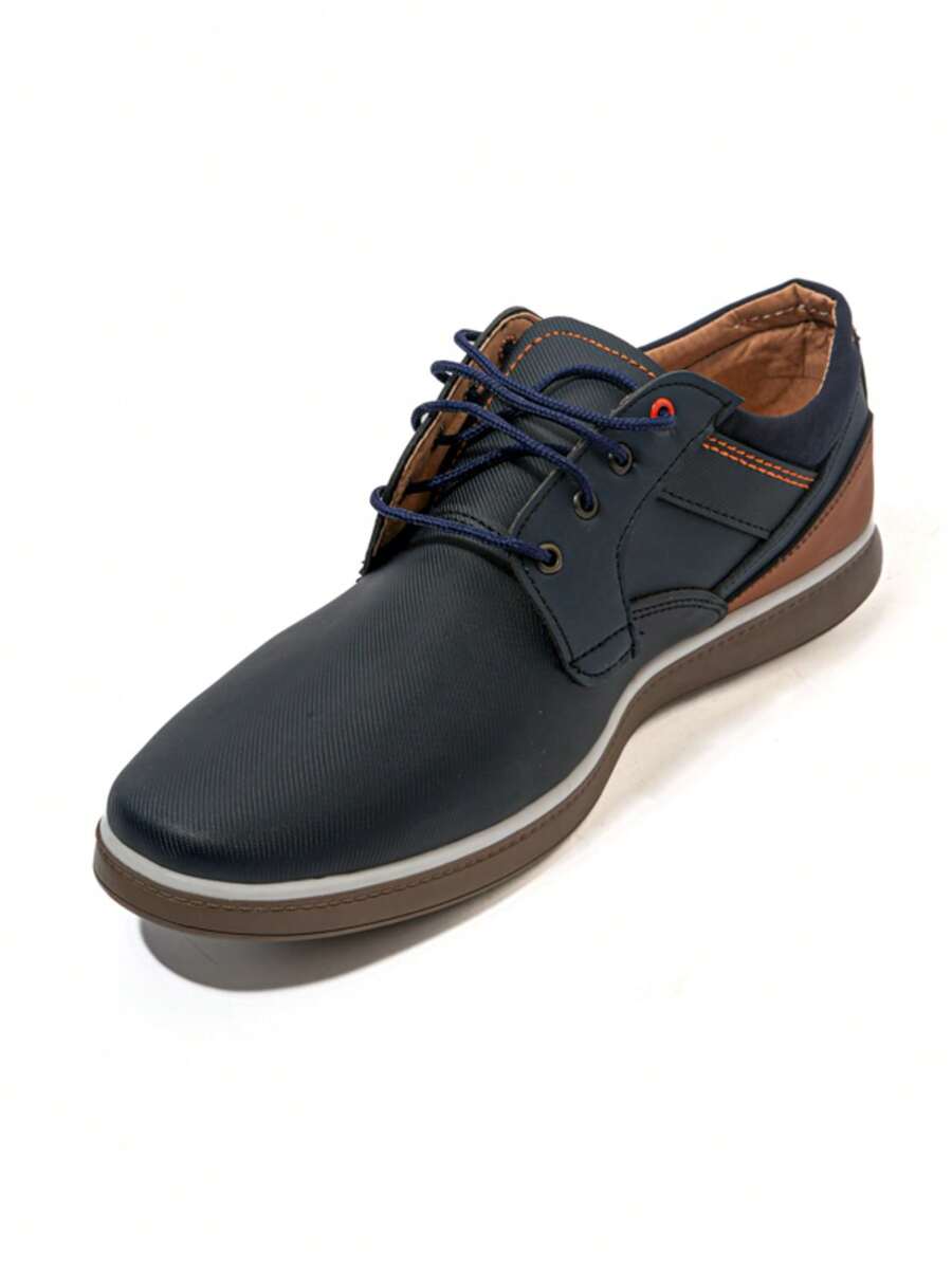 Zapatos casuales de tipo vestir para hombre modernos, versátiles y cómodos, con ajuste con cordones, ideales para diversas ocasiones, desde reuniones de trabajo informales hasta salidas sociales o eventos semi formales, que le dan un toque de sofisticación dentro del calzado masculino. - Azul Marino - Ver 1