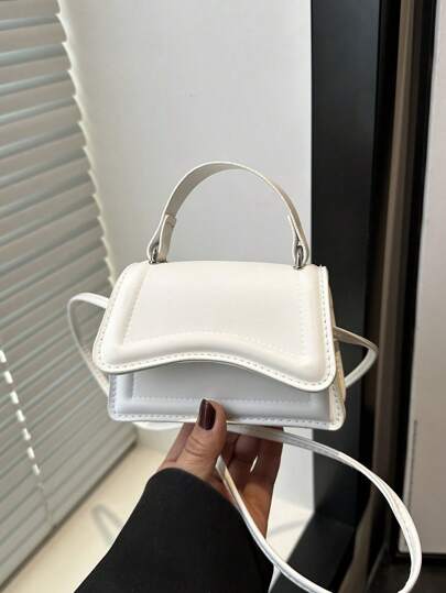 时尚纯色极简迷你手提包，女士腋下斜挎包，适合购物、日常携带，尤其适合年轻女性、大学生、年轻职业人士、上班族。也适合办公室、学校、工作、商务、通勤、户外活动、旅行和短途旅行。