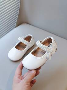 Nuevos zapatos planos elegantes para niñas con diseño de lazos de perlas, calzado versátil para uso diario y casual, de fácil puesta y livianos