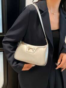 新款时尚休闲女士单肩包，PU 皮革纯色（黑色、咖啡色、卡其色），蝴蝶结和金属装饰，腋下钱包和化妆包