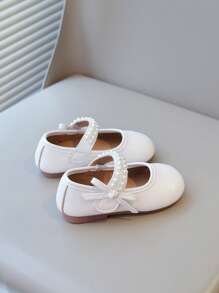 Nuevos zapatos planos elegantes para niñas con diseño de lazos de perlas, calzado versátil para uso diario y casual, de fácil puesta y livianos