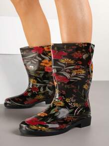 Gummistiefel mit bunten Blumen und Blättern