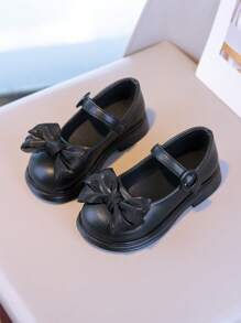 Zapatos elegantes negros para niñas: El lacito añade un Charm femenino
