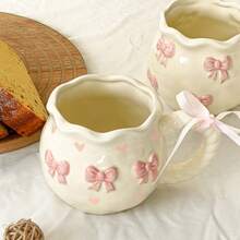 1pc Creative 3D Embossed Hand-Painted Bow Pattern Ceramic Coffee Mug With Ribbon, Gift Packaging Back To School