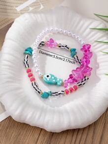 Set de 2 pulseras bohemias con cuentas para mujeres con dije de pez, hechas a mano de cerámica con agrietamiento y defectos normales, joyería de estilo vacacional