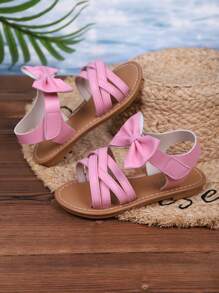 Sandalias casuales nuevas de verano 2025 para niños, diseño de lazo rosa, apariencia de moda, versátiles, sandalias casuales populares