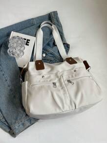 In 2025, The New Fashion Classic Joker Solid Color Large-Capacity Multi-Pocket Contrasting Hand Bill Of Lading Design Leisure Canvas Messenger Bag Is Suitable For Traveling On Campus.