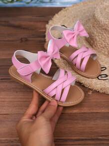 Sandalias casuales nuevas de verano 2025 para niños, diseño de lazo rosa, apariencia de moda, versátiles, sandalias casuales populares