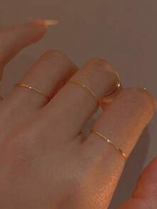 Tkool Set de 5 anillos de acero inoxidable sencillos, de color dorado, apilables y ajustables para mujeres, talla 7 - Amarillo Oro - Ver 8