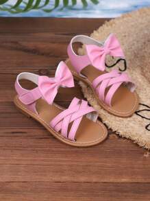 Sandalias casuales nuevas de verano 2025 para niños, diseño de lazo rosa, apariencia de moda, versátiles, sandalias casuales populares