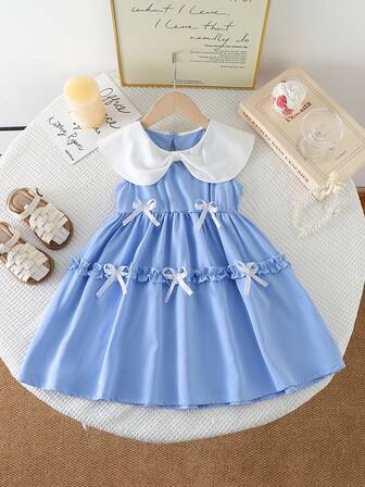 年轻女孩撞色荷叶边下摆优雅连衣裙，配手工蝴蝶结