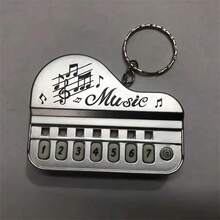 1 pieza Piano electrónico en miniatura con llavero, adecuado para aliviar la presión de los dedos, entretenimiento, práctica de interpretación, el mejor regalo para la felicidad