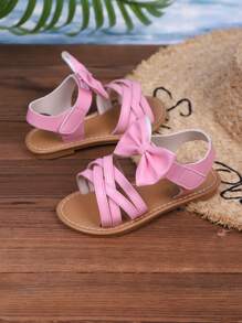 Sandalias casuales nuevas de verano 2025 para niños, diseño de lazo rosa, apariencia de moda, versátiles, sandalias casuales populares