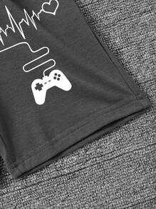 Conjunto de camiseta de manga corta con estampado gráfico de letras y pantalones cortos para niño, adecuado para el verano