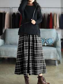 Chân váy kẻ caro phong cách retro mùa xuân hè mới, màu nâu, cạp cao, dáng xòe, dài ngang gối, kiểu dáng rừng cây đa năng, ôm sát và che phủ hông. Thiết kế kẻ caro retro, thoáng khí và thân thiện với da mà vẫn giữ được phom dáng. Thích hợp cho công sở và các dịp hàng ngày, đây là một món đồ đa năng giúp nâng tầm tủ đồ mùa xuân hè của bạn. Màu đen - màu đen - Xem 4