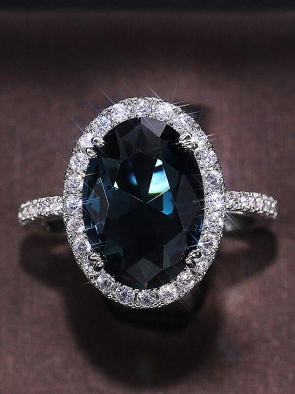 1 Peça Novo Anel de Cristal de Zircônia Cúbica Azul Oval de Luxo e Elegante com Quatro Garras, Anel em Formato de Ovo de Cristal Azul de Material de Cobre Simulando Anel de Noivado de Água-Marinha, Presente para Filha, Mãe, Entes Queridos, Adequado para Jóias Casuais Diárias, Casamento e Festa das Mulheres