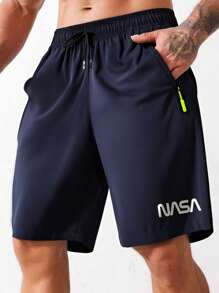 Shorts deportivos tipo novio con diseño gráfico de letras Corelite para hombres, shorts de gimnasia, shorts jogger con bolsillo con cremallera y cordón en la cintura, para entrenamiento, correr, gimnasio en verano