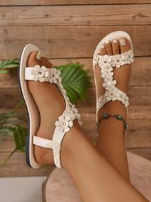 Sandales plates larges pour femmes, sandales élégantes de mode pour dames avec décoration florale , polyvalentes pour fête, port casual en extérieur