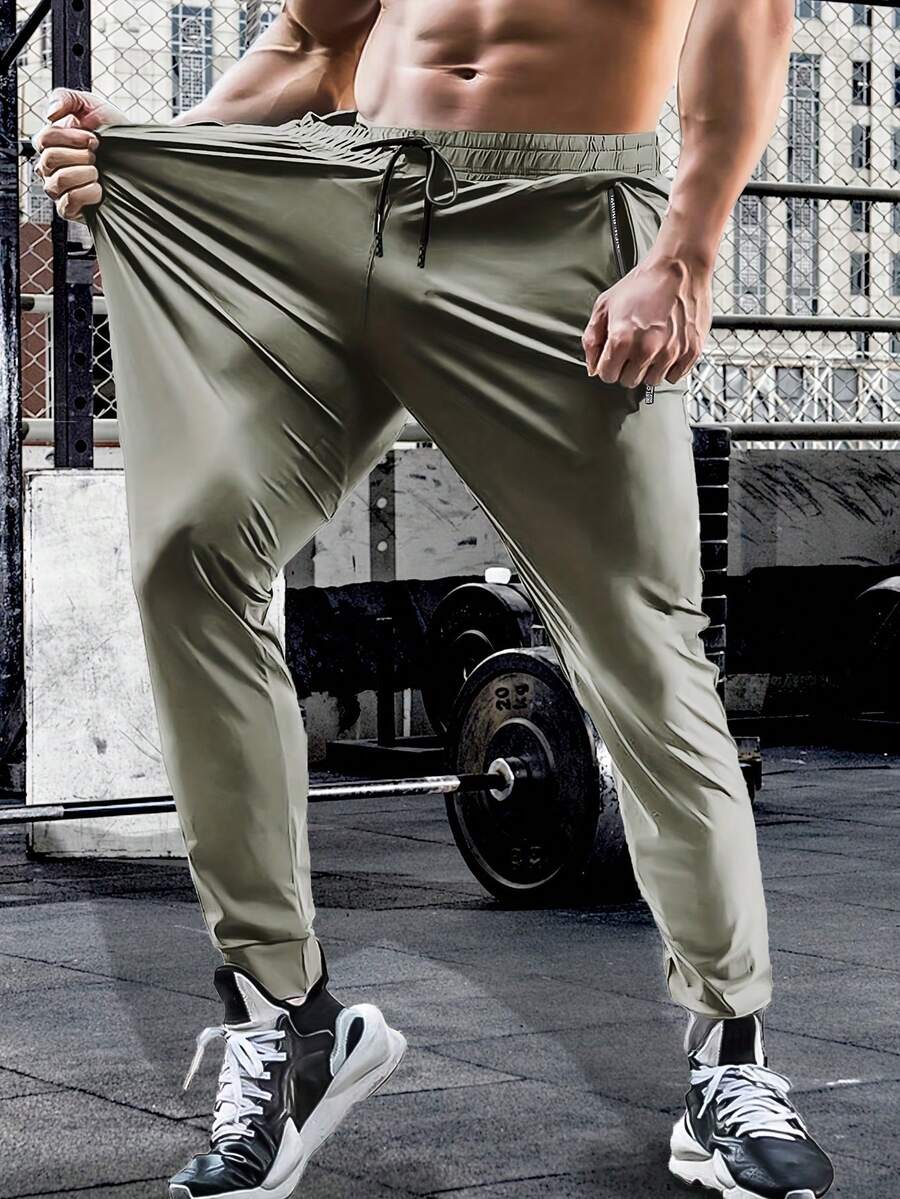 Pantalones deportivos de entrenamiento para hombre de verano y primavera, cintura con cordón, alta elasticidad, unicolor, bolsillos con cremallera, para actividades al aire libre y senderismo - Caqui - Ver 1