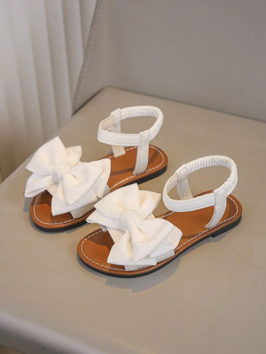 一双女童凉鞋夏季新款蝴蝶结公主鞋松紧带设计软底休闲女童沙滩鞋。 - 白色 - 查看 1