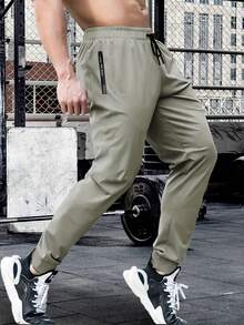 Pantalones deportivos de entrenamiento para hombre de verano y primavera, cintura con cordón, alta elasticidad, unicolor, bolsillos con cremallera, para actividades al aire libre y senderismo - Caqui - Ver 3