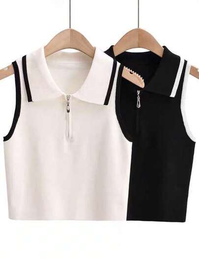 一件黑白撞色彼得潘领半拉链短款无袖修身针织毛衣，领子可拆卸，适合圣诞装饰。