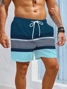 男士印花撞色条纹短裤，腰部有抽绳和口袋，夏季街头时尚海滩度假短裤