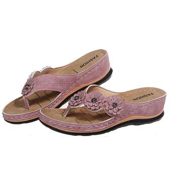 A Pair Of Matte Comfortable Casual Flip-Flops With Three Flower Designs.