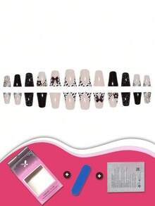 一盒24片中长方形假指甲，黑白豹纹设计，结合立体蝴蝶结和星形装饰，展现前卫时尚风格。附赠指甲锉和指甲擦条，时刻保持指尖精致魅力。 - 彩色 - 查看 3