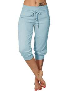 Fisoew Pantalones de yoga ajustados capri para mujer, pantalones de pijama holgados con cordón y bolsillos. - Azul cielo - Ver 1