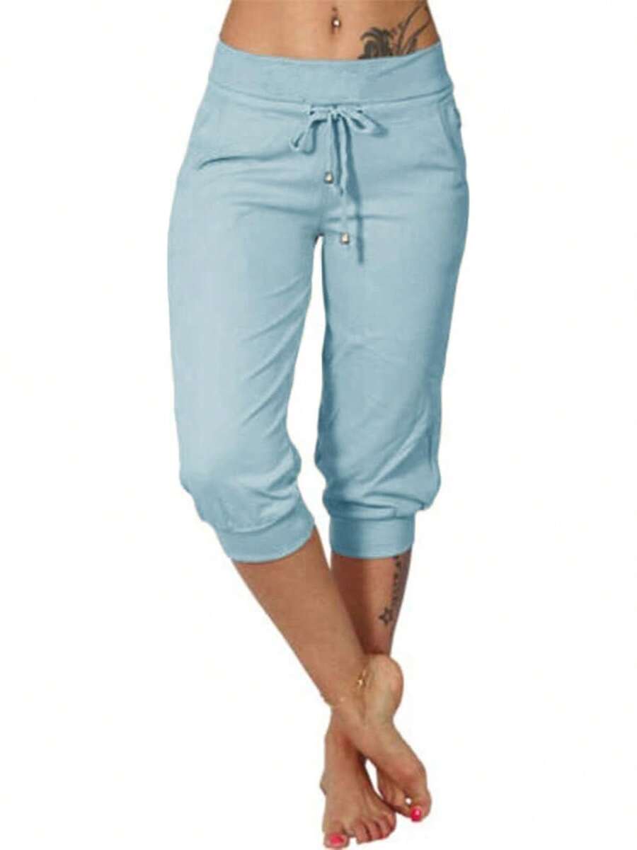 Fisoew Pantalones de yoga ajustados capri para mujer, pantalones de pijama holgados con cordón y bolsillos. - Azul cielo - Ver 1