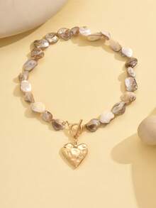 1件夏日海洋风天然贝壳串珠项链，搭配时尚金色金属心形吊坠颈链，适合日常佩戴、海滩旅行、约会和摄影。天然贝壳的数量、图案和大小随机。 - 貝殼片+心型 - 查看 3