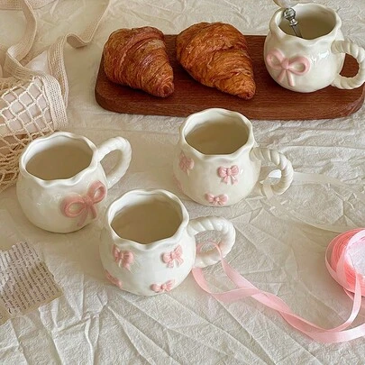 1pc Creative 3D Embossed Hand-Painted Bow Design Ceramic Coffee Mug With Ribbon, Delicate Packaging, Ideal For Gifts