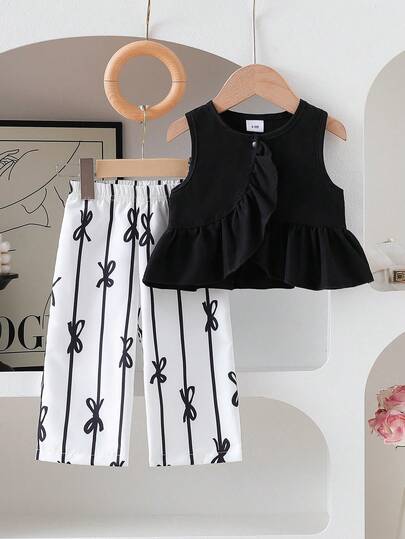 女婴休闲优雅黑色荷叶边拼接不对称上衣和全身蝴蝶印花阔腿裤套装，适合户外穿着