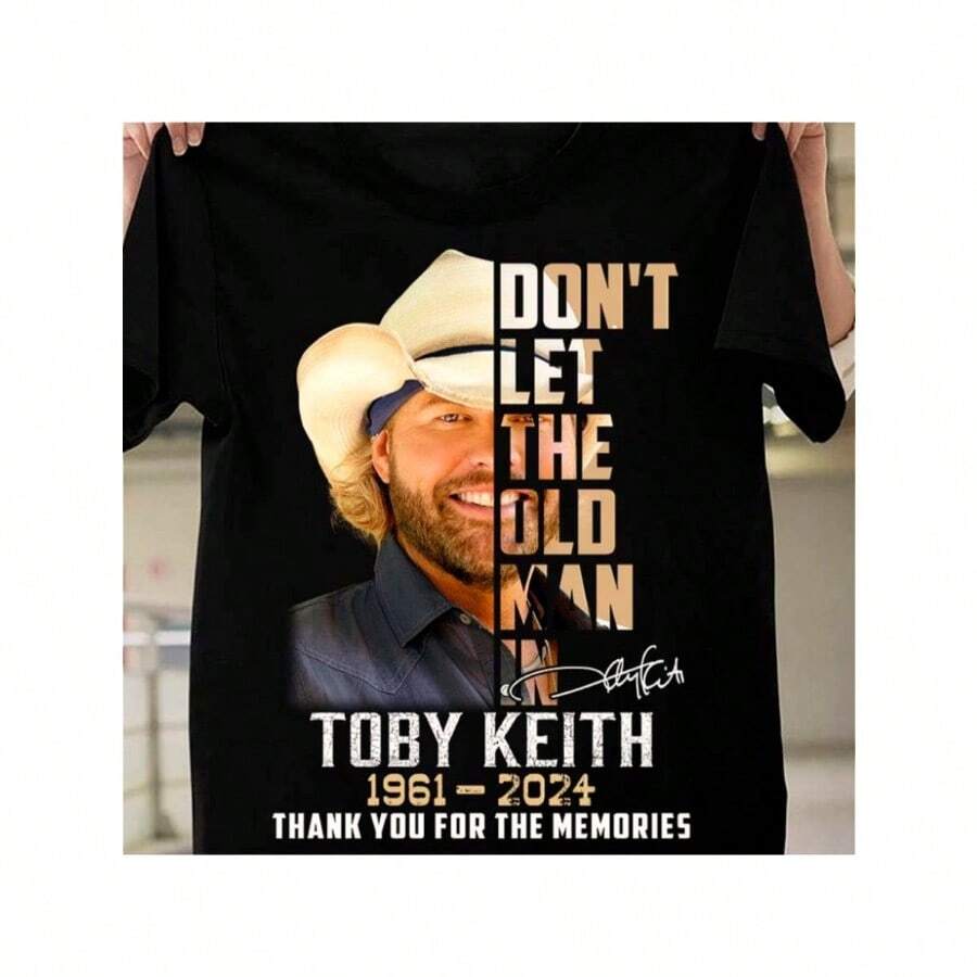 Camiseta gráfica "No dejes que entre el viejo" de Toby Keith - Camiseta de algodón informal unisex, negra con impresión dorada y blanca, manga corta, cuello redondo, regalo perfecto para el Día de San Valentín, Pascua y Día de la Beca - Negro - Ver 1