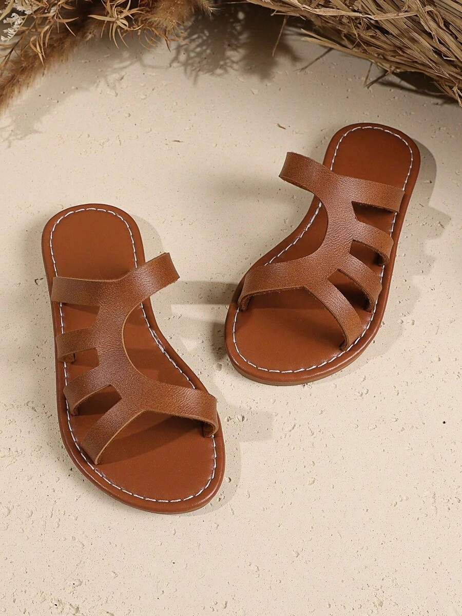 1 Pair Brown Toddler/Kids Plus Size Hollow Slide Sandals, Soft PU Upper, Slip-On, Non-Slip Durable TPR Sole, Solid Color Simple Roman Design, Suitable For 3-15 Year Olds Boys Girls, Beach, Vacation, Casual Wear, 2025 New Arrival - View 1