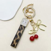 TTOBS 1pc Exquisitely Crafted Leopard Print Leather Car Key Chain With Adorable Cherry Pendant - , Fashionable And Multi-Functional Backpack Keychain - The Perfect Accessory For Backpacks. The Perfect Valentine's Day Gift, Also An Ideal Gift For Your Beloved Girlfriend.