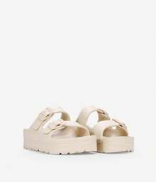 Bosanova ✅ Entrega 24/72h Sandalias de goma estilo pala con dos tiras al empeine con detalle de hebillas regulables y suela de plataforma. sin cierre beige