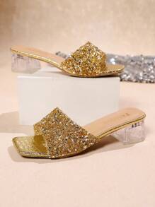 Sandalias de tacón grueso con puntera cuadrada y cristales transparentes, diseño elegante y versátil.