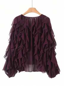 Camisa con volantes en el bajo y diseño de unicolor