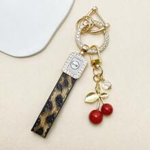 TTOBS 1pc Exquisitely Crafted Leopard Print Leather Car Key Chain With Adorable Cherry Pendant - , Fashionable And Multi-Functional Backpack Keychain - The Perfect Accessory For Backpacks. The Perfect Valentine's Day Gift, Also An Ideal Gift For Your Beloved Girlfriend.