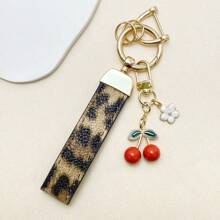 TTOBS 1pc Exquisitely Crafted Leopard Print Leather Car Key Chain With Adorable Cherry Pendant - , Fashionable And Multi-Functional Backpack Keychain - The Perfect Accessory For Backpacks. The Perfect Valentine's Day Gift, Also An Ideal Gift For Your Beloved Girlfriend.
