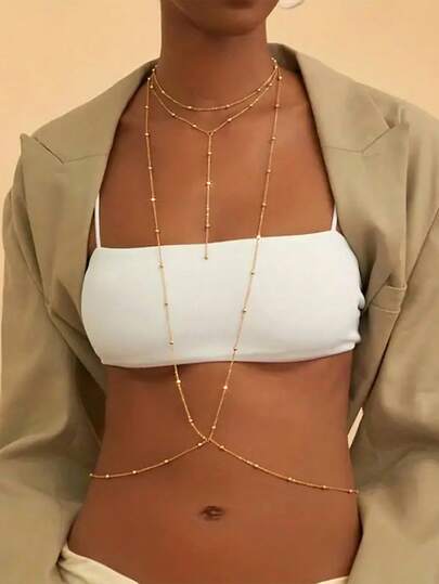 This Fashionable And Sexy Gold Sphere Chain Features Multiple Layers Of Gold Beads At The Top, With A Vintage And Unique Design. Crafted Specifically For Women, This Multi-Strand Necklace Cleverly Incorporates An X-Shaped Chain Element. This Captivating Bikini Chain Is An Ideal Choice For Beach Vacations And Can Also Be Worn By Ladies At Parties.