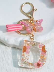 1 szt. Damski brelok z inicjałem i suszonym kwiatem, uroczy mini breloczek z stokrotką, ozdoba torby/plecaka, frędzel w kształcie motyla, akcesoria szkolne, akcesoria samochodowe, gotyckie smycze do torebek Y2k z uchwytem na identyfikator, zawieszki do torebek samochodowych - Słodki róż - Zobacz 25