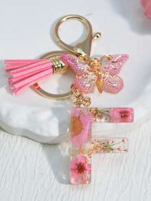 1 szt. Damski brelok z inicjałem i suszonym kwiatem, uroczy mini breloczek z stokrotką, ozdoba torby/plecaka, frędzel w kształcie motyla, akcesoria szkolne, akcesoria samochodowe, gotyckie smycze do torebek Y2k z uchwytem na identyfikator, zawieszki do torebek samochodowych - Słodki róż - Zobacz 29