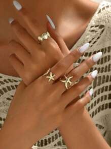 Set de 3 anillos ajustables con diseños metálicos de la serie del océano, incluyendo estrellas de mar y conchas en 3D