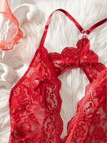 Body sexy de mujer con cuello en V profundo transparente, tejido jacquard, espalda descubierta, decoración de lazo en el pecho, encaje floral cruzado en la entrepierna, decoración de hebilla metálica con forma de corazón, recorte ondulado, tirantes ajustables